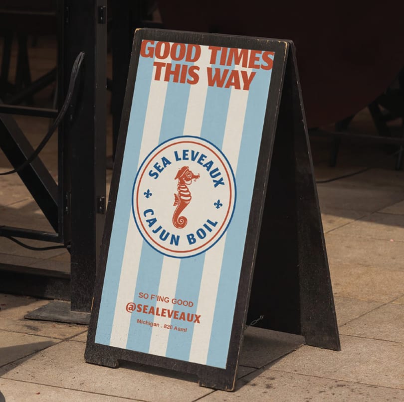 A-frame sign for Sea Leveaux Cajun Boil with a seahorse logo and "Good Times This Way" text.